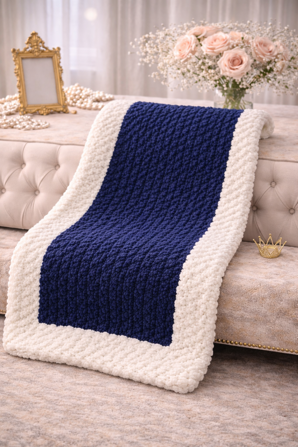 The Newport Luxe Chunky Large Knit Crochet Throw 50 x 60 styled in a luxury boutique setting